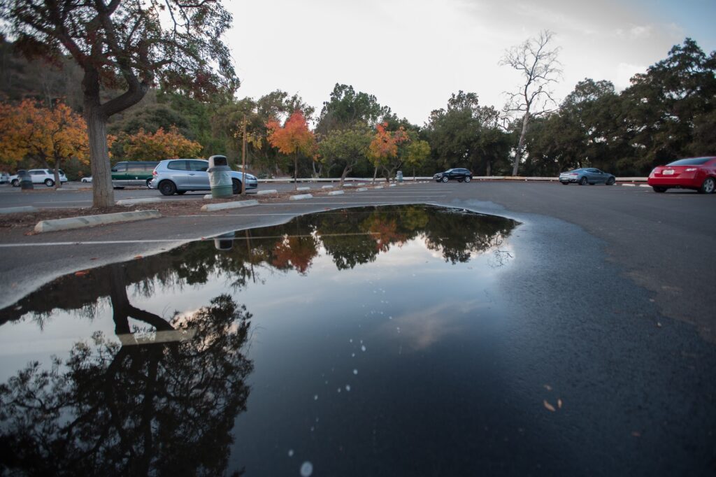 puddles in autumn parking lot