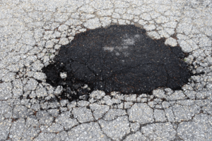 A patch of repair on asphalt