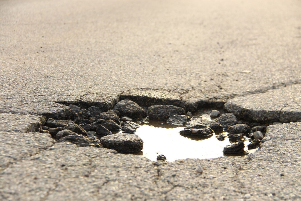 A pothole in asphalt in El Paso.